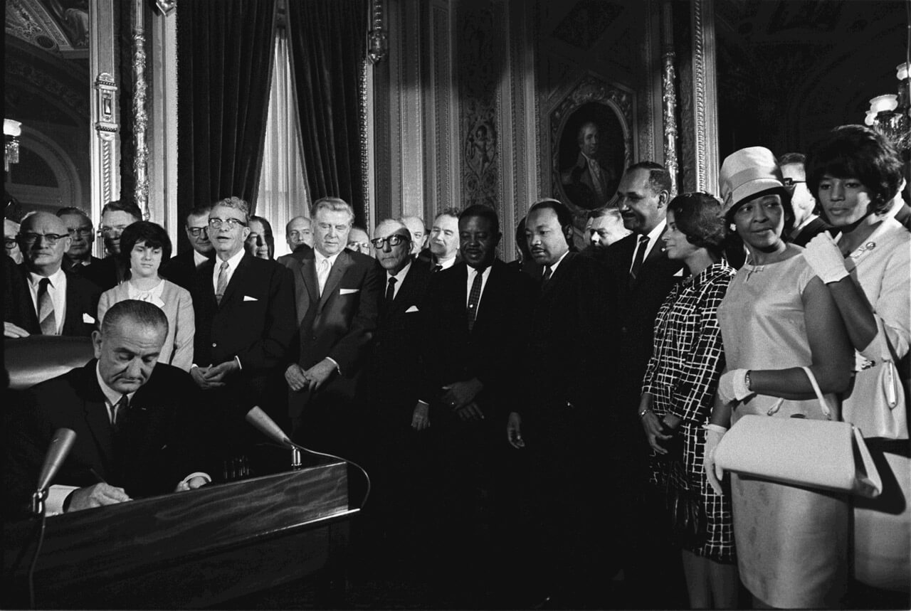 Lyndon Johnson signing the Voting Rights Act of 1965