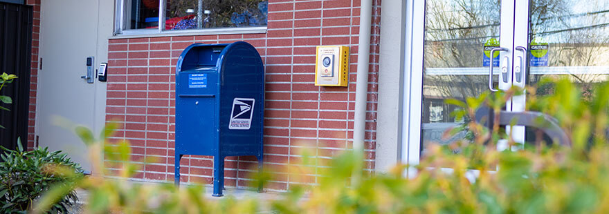 USPS dropbox outside of the west entrance to the Student Union Building on the SPU campus