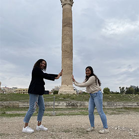 Lucy Urbach – American tourist hold up the Temple of Zeus in Athens