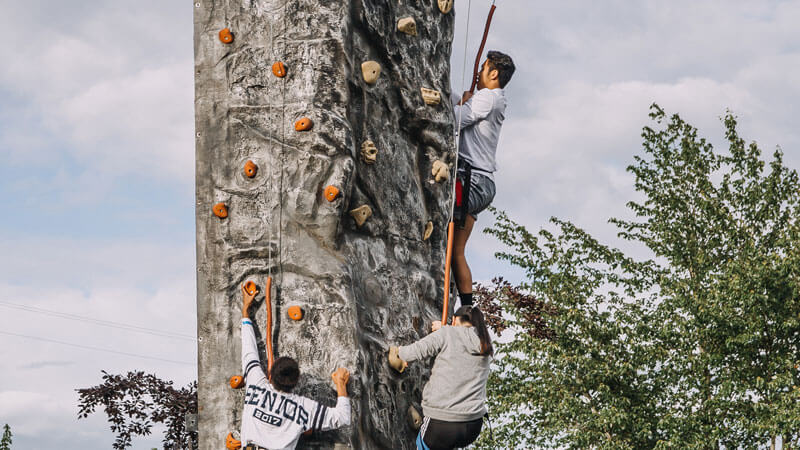 students rock climbing