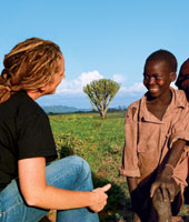 Allison Hosley '98 chats with a Karamajong boy in NE Uganda.