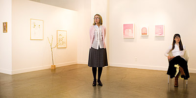 Laura Lasworth and Katie Kresser photographed inside SPU Art Center Gallery