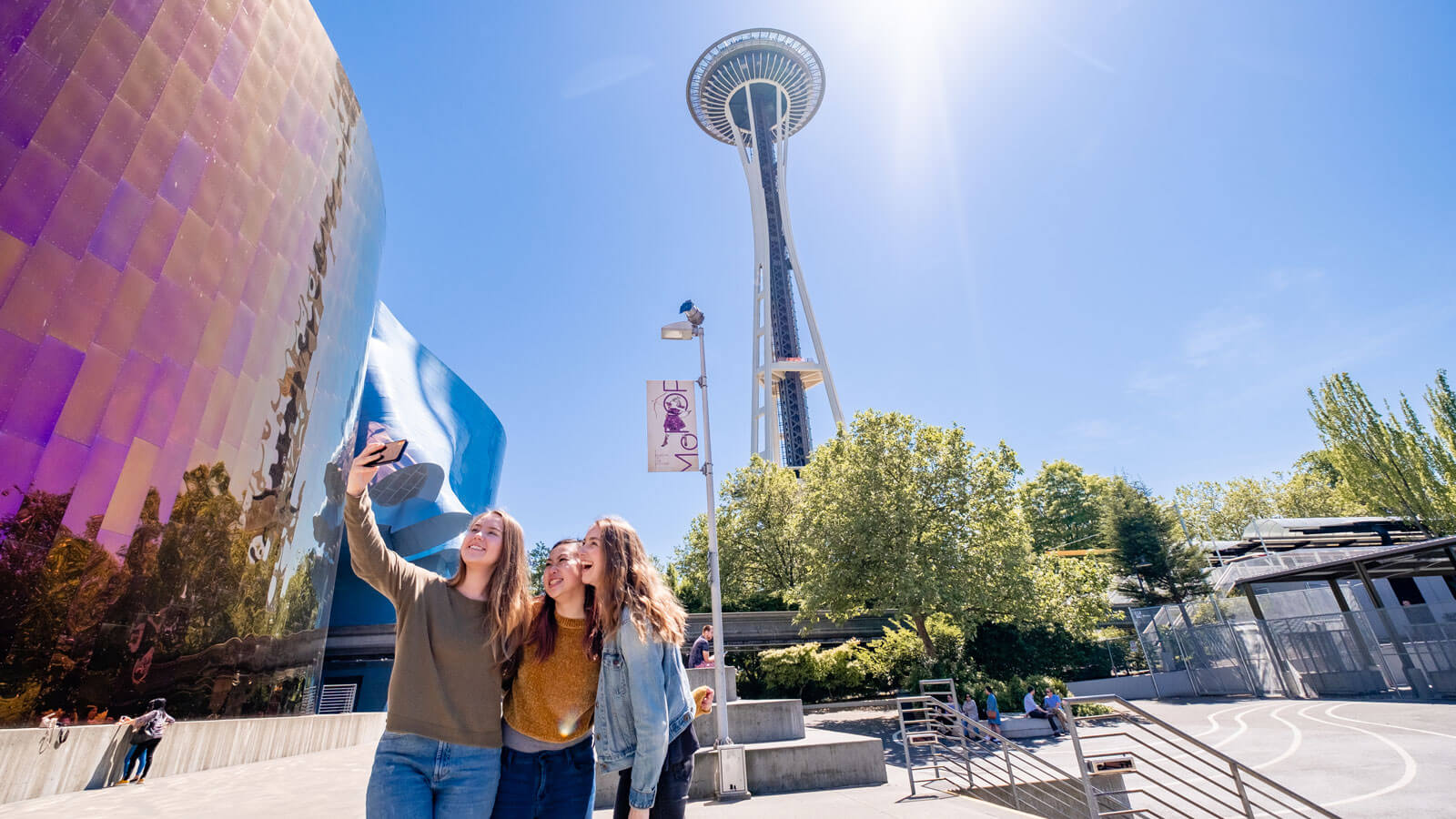 3 friends take a selfie near the space needle