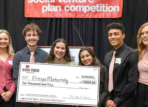 Students celebrating at a business plan competition