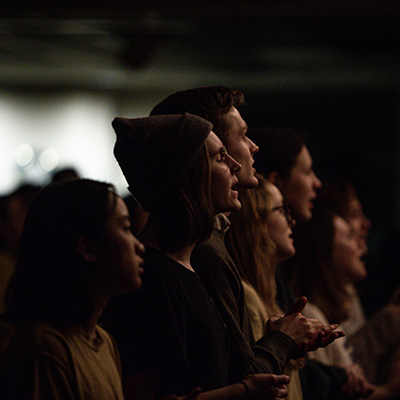 Students participating in a worship service on campus