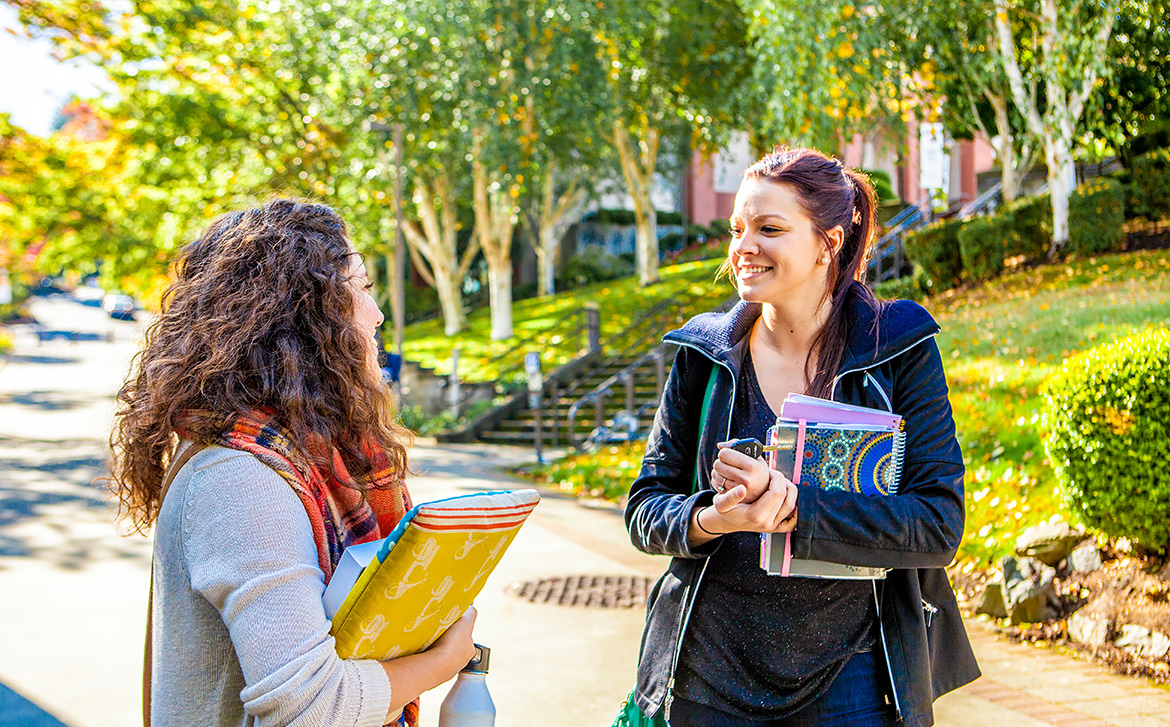 Two students laughing at SPU campus