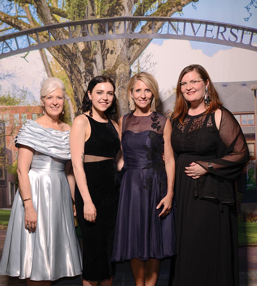 Left to right: Furrow, student designer Sarah Maberry, Pam Martin, and apparel design faculty member Sarah Mosher.