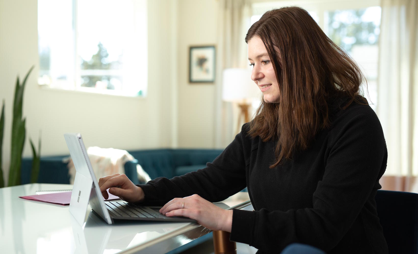 A student works from her laptop