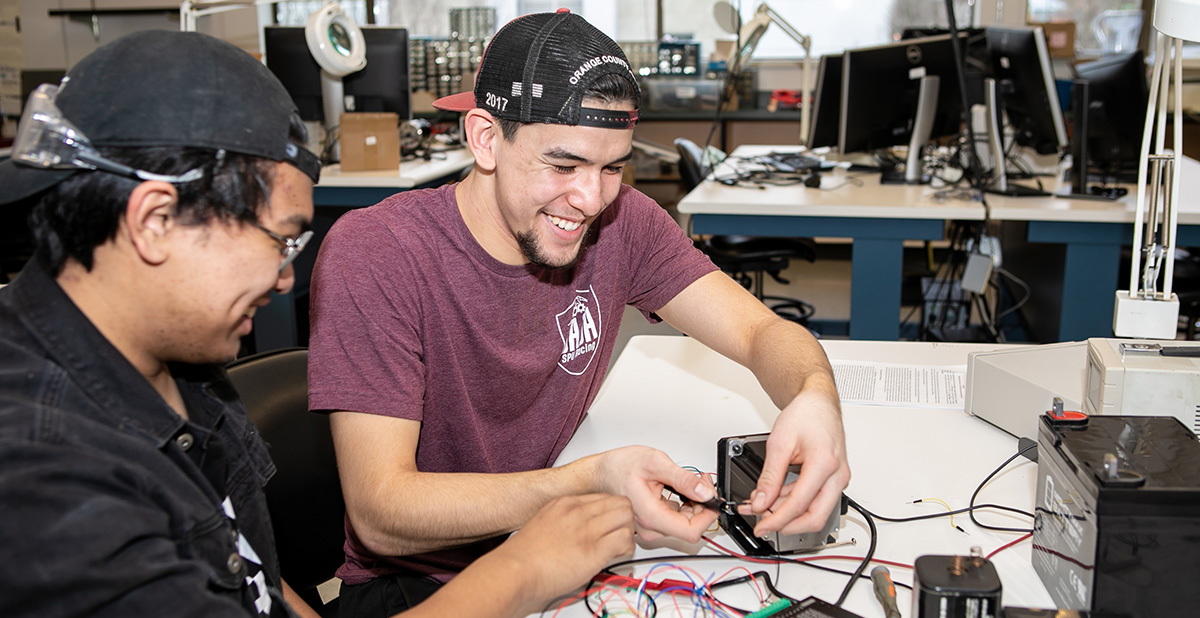Electrical engineering students work on a project