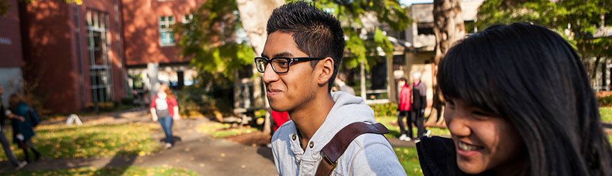 SPU students walk across campus together on a sunny fall day