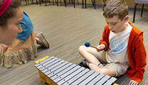 Child Playing Drum