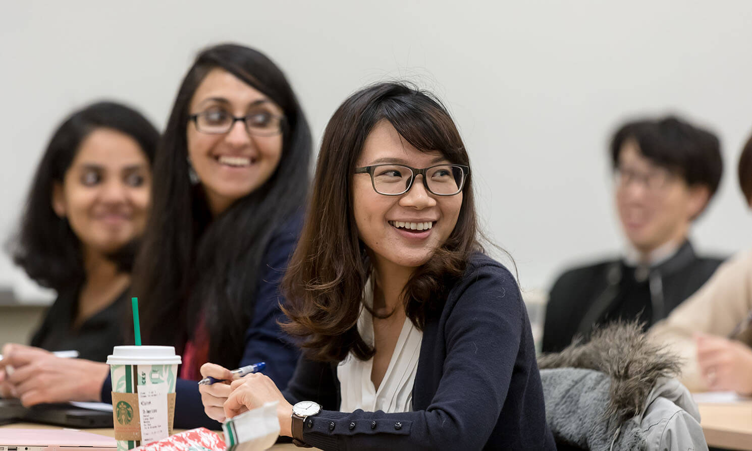 Graduate students participate in a group discussion