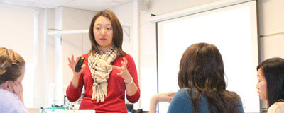 Doctor June Hyun teaching a graduate course