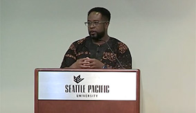 Jemar Tisby delivers a lecture in Upper Gwinn
