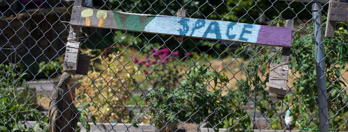 community garden sign reads "space"
