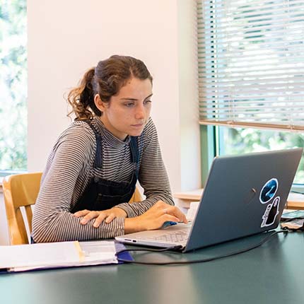 An SPU student studies in the library
