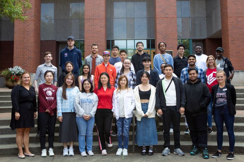 Group of new international students on library steps