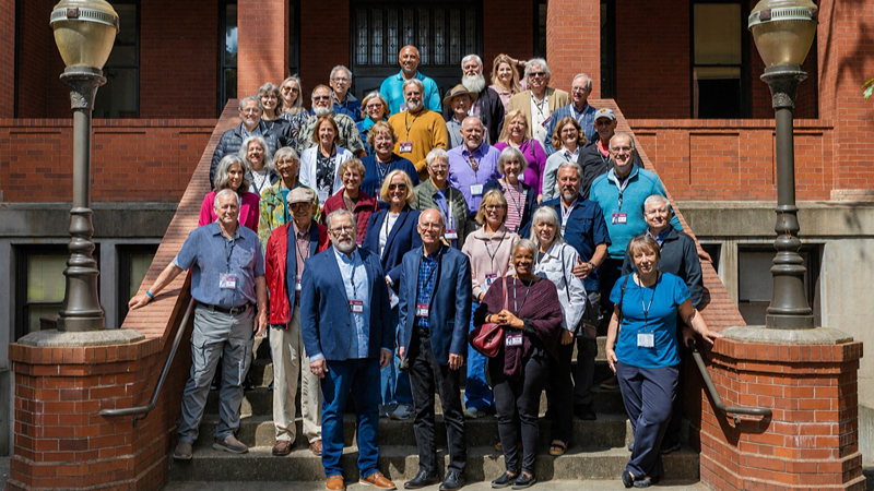 Class of 1976 alumni gather on the steps of Peterson Hall during the 50th Class Reunion in June 2026.