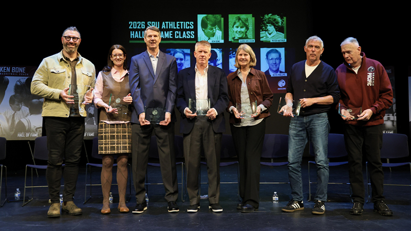 The five men and two women Falcon Hall of Fame 2026 inductees at the Feb. 7, 2026, event in Bach Theatre on the Seattle Pacific University campus