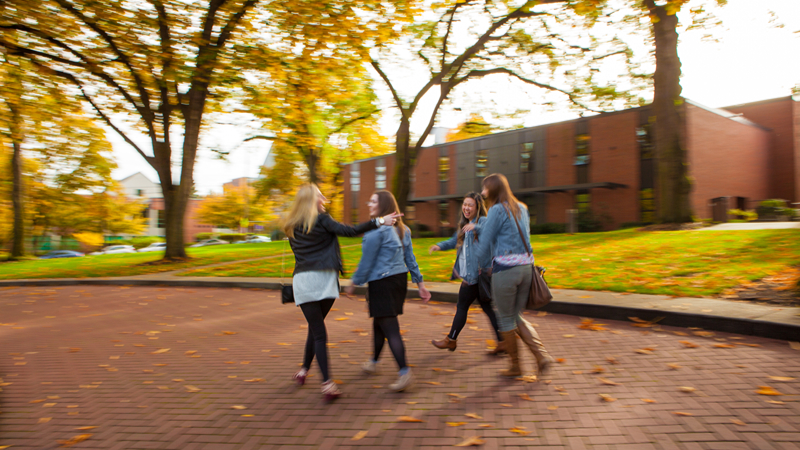 SPU students laughing and walking in Tiffany Loop