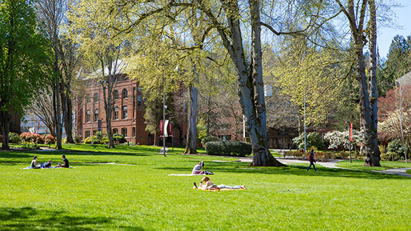 Students study in Tiffany Loop on a bright Spring day