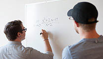 Mathematics students at a whiteboard