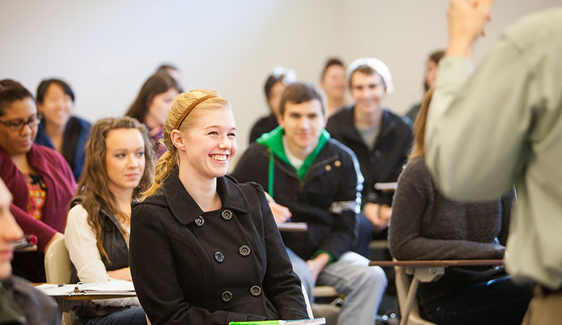 School of Theology, student laughing in classroom