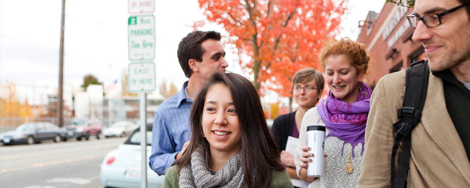 Graduate students from Seattle Pacific University walk together on campus.