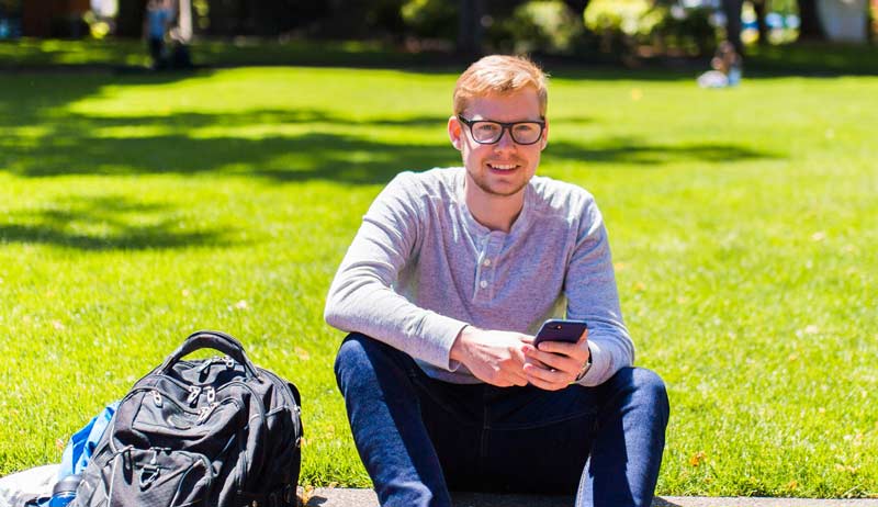 Student sitting outside