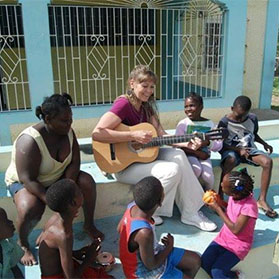 Hope Evans – Mom singing and sharing music with children in Jamaica