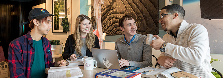 SPU grad students study together in a coffee shop | photo by Dan Sheehan