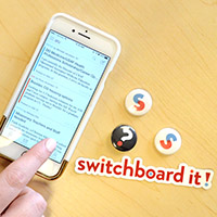 A hand uses the Switchboard app on an iPhone
