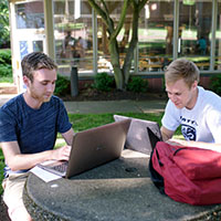 SPU students studying outside by the Student Union Building