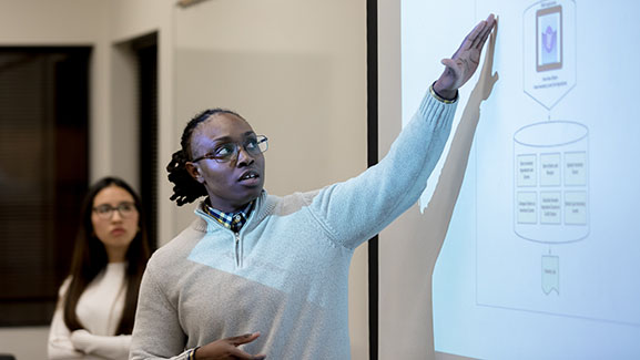 An SPU student presents in a master's program course 