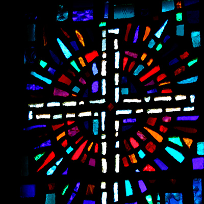 An image of the stained glass window in Alexander and Adelaide Hall on the SPU campus