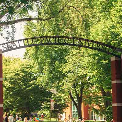 The arch that includes the words "Seattle Pacific University" and stretches across the entrance to Tiffany Loop.