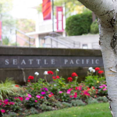 sign of Seattle Pacific with flowers
