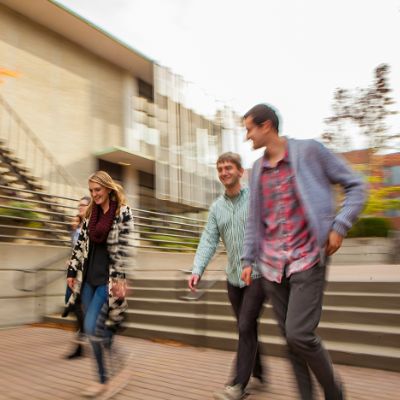 Four students walking through Martin Square.