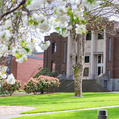 A springtime image of McKinley Hall as seen from across Tiffany Loop on the SPU campus