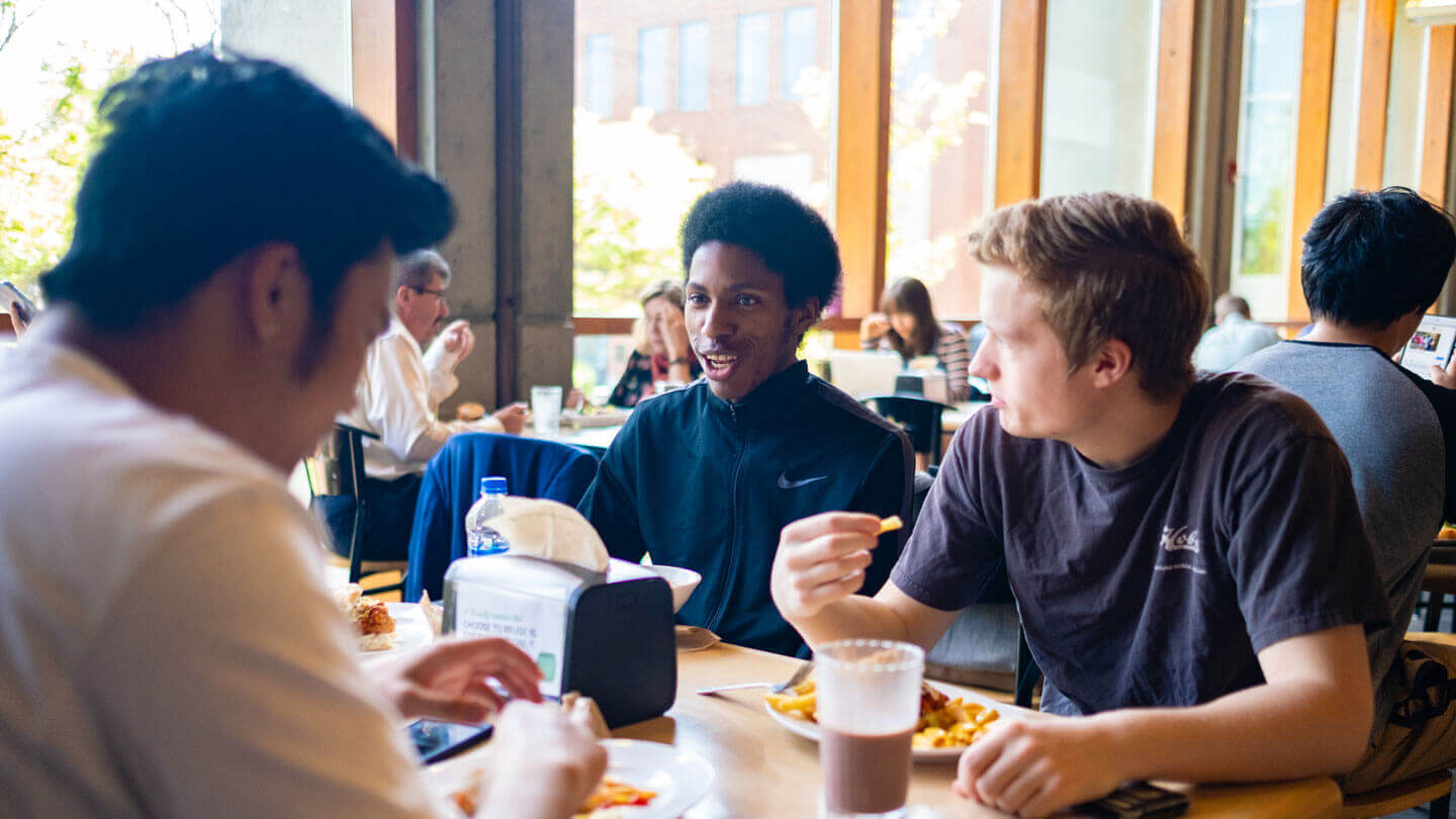 male students dine at gwinn commons