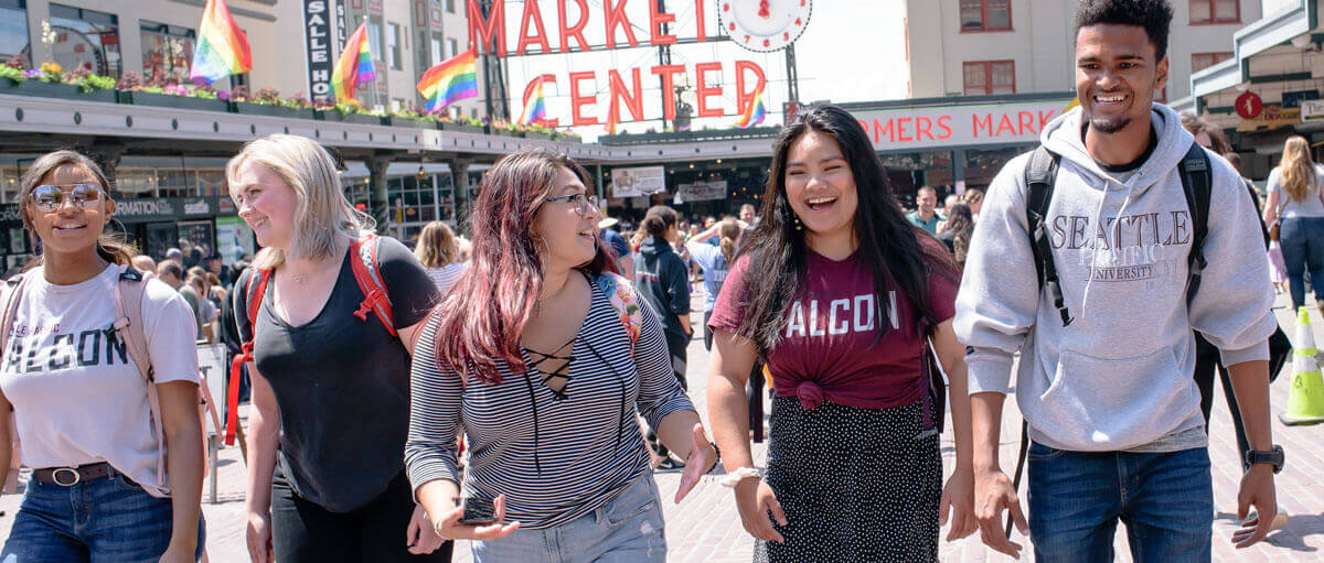 students walk through pike place market