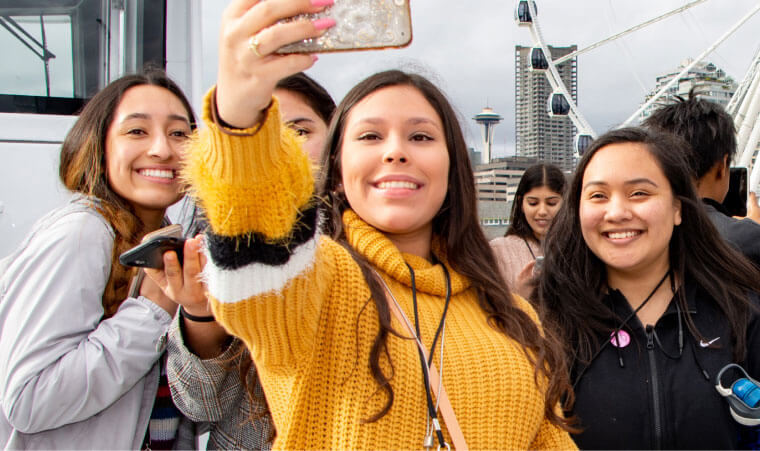 students take a group selfie