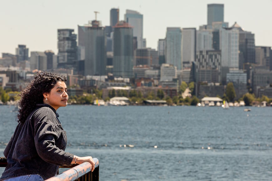 A student looks out on Lake Union from Gasworks park.