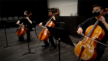 SPU orchestra cellists perform in Nickerson Studios