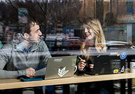 MBA students work together in a coffee shop | photo by Dan Sheehan