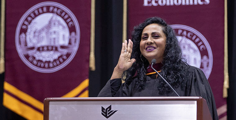 Chitra Hanstad, executive director for World Relief Seattle, speaks at the 2019 Graduate Commencement ceremony - photo by Dan Sheehan