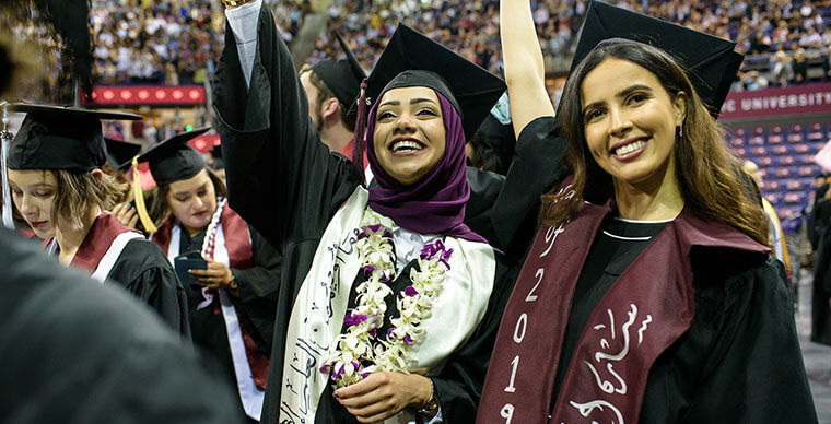 SPU students wave to family at the 2019 Undergraduate Commencement ceremony - photo by John Crozier