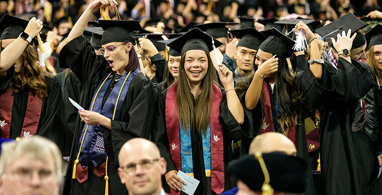 SPU students move their tassels over at the 2019 Undergraduate Commencement ceremony
