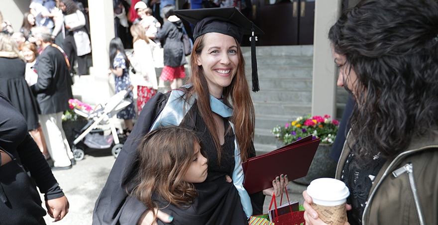 After the SPU Graduate Commencement Ceremony, the recipient of a master