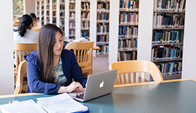 A student studying in SPU's library